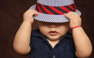 baby with blue cap