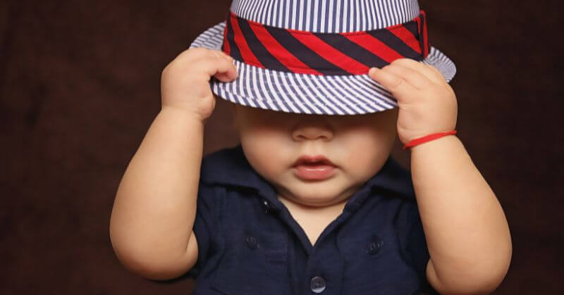 baby with blue cap