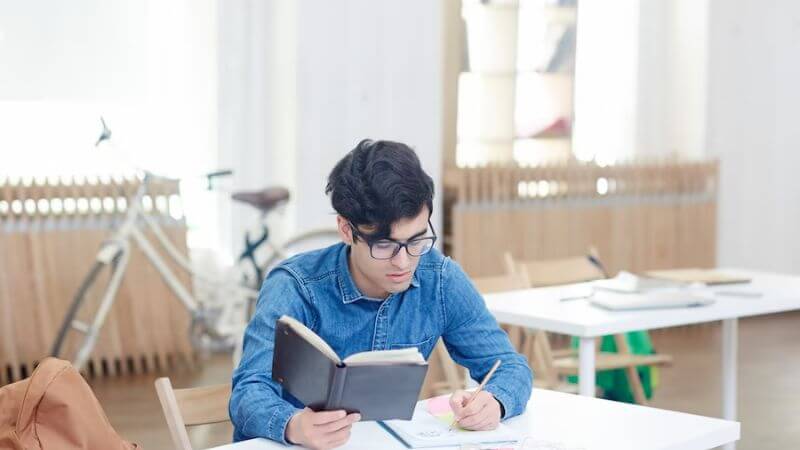 Boy doing paper work