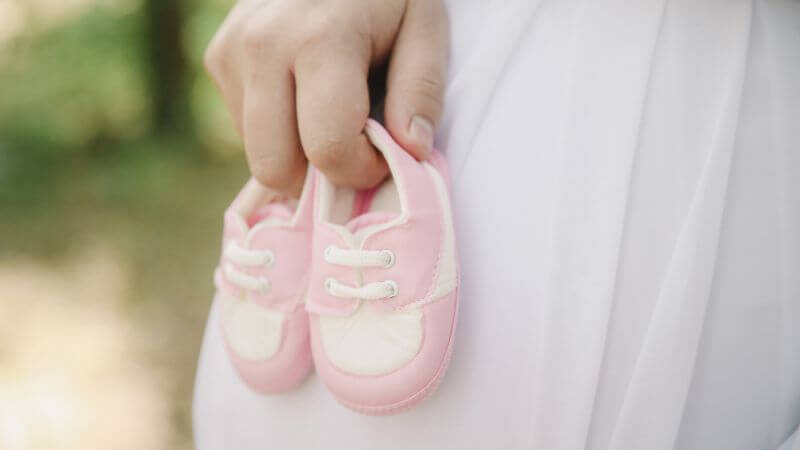 Pink and white baby shoes