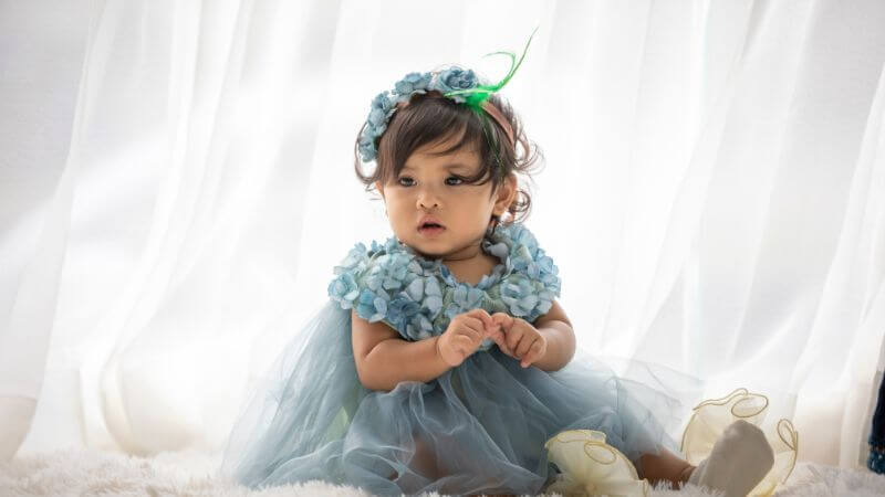 Baby girl with blue frock