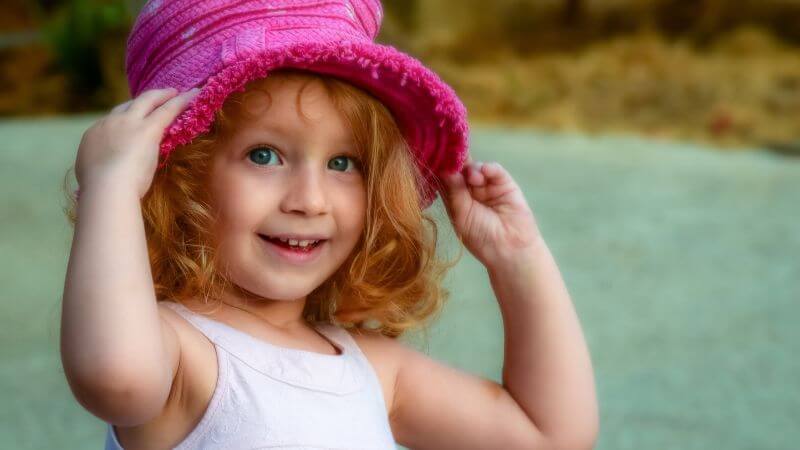 Cute girl with pink hat