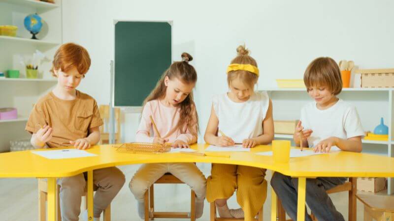 Kids siting on table